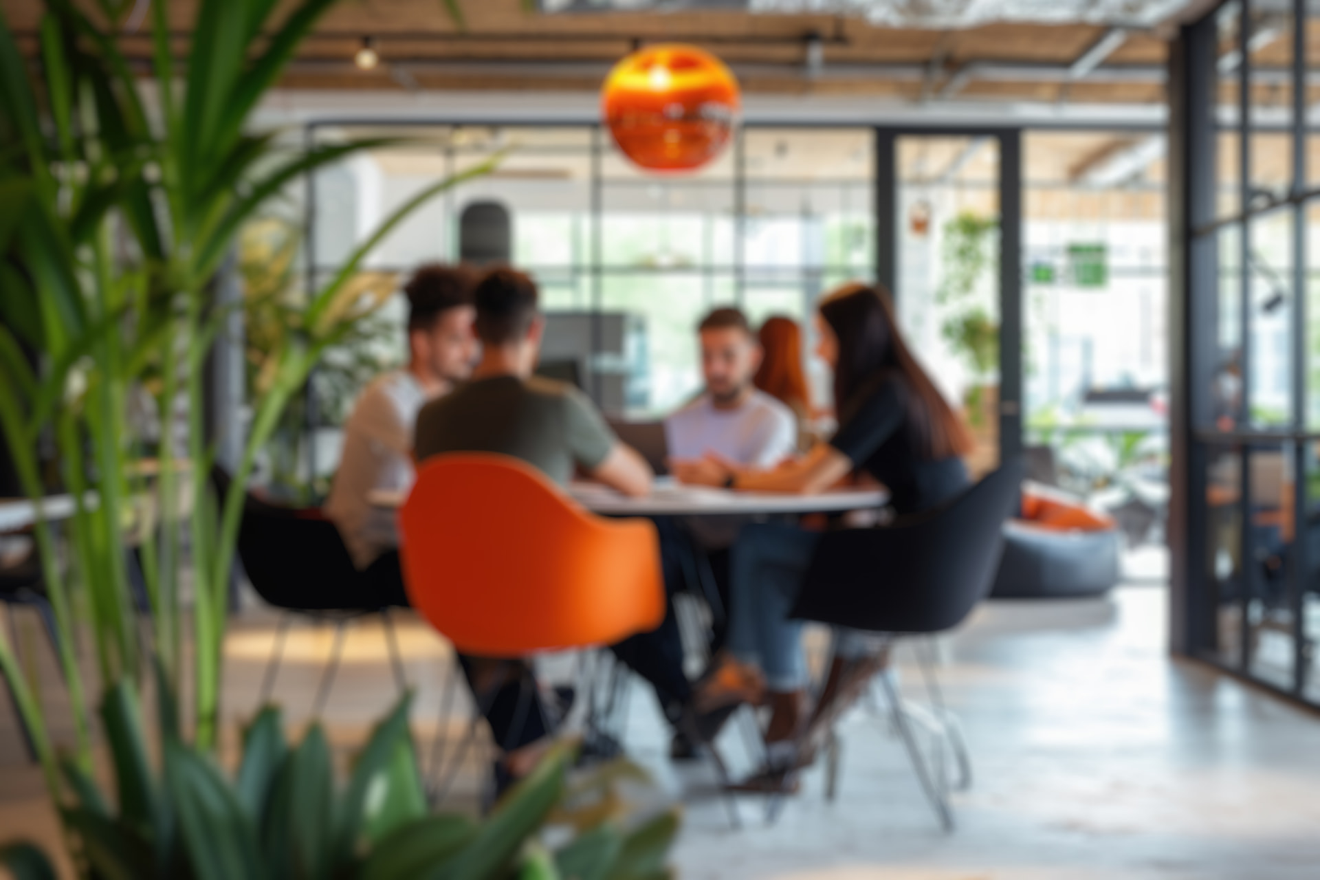 Diverse professionals collaborating around a table in a modern office